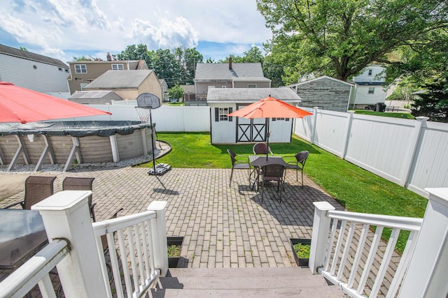 20 Bryant Ave, Bloomfield, NJ 07003 - fenced backyard with a storage shed, a patio area, outdoor dining area, and a residential view