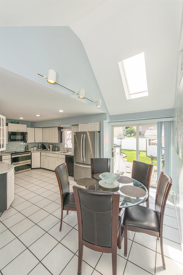 20 Bryant Ave, Bloomfield, NJ 07003 - dining space featuring plenty of natural light, light tile patterned flooring, high vaulted ceiling, and a skylight