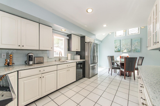 20 Bryant Ave, Bloomfield, NJ 07003 - kitchen featuring freestanding refrigerator, black dishwasher, decorative backsplash, white cabinets, and recessed lighting