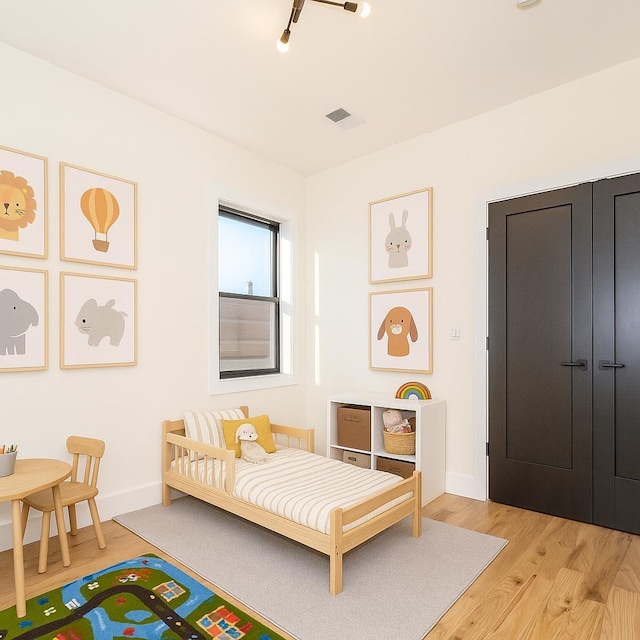 141 Sherman Ave Unit 1, Jersey City, NJ 07307 - bedroom with light wood finished floors and baseboards