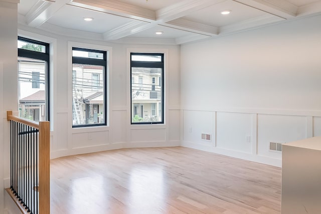 141 Sherman Ave Unit 1, Jersey City, NJ 07307 - spare room with a decorative wall, healthy amount of natural light, light wood-style floors, beam ceiling, and coffered ceiling