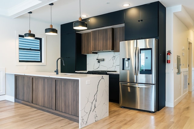 141 Sherman Ave Unit 1, Jersey City, NJ 07307 - kitchen with stainless steel refrigerator with ice dispenser, modern cabinets, light wood finished floors, backsplash, and a peninsula