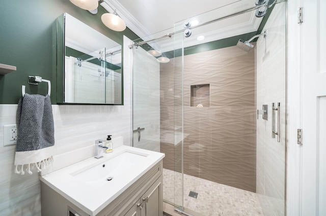 249 Grove St Unit 1, Jersey City, NJ 07302 - bathroom featuring vanity, crown molding, a stall shower, and tile walls