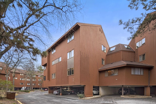 view of property featuring covered parking