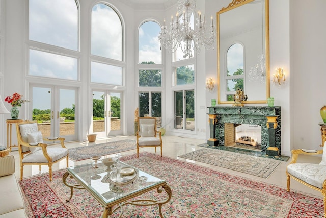 sunroom with a fireplace and plenty of natural light