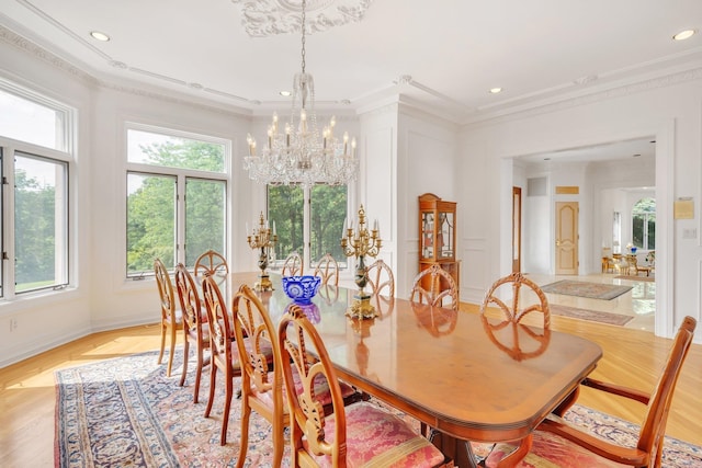 dining room featuring an inviting chandelier and crown molding