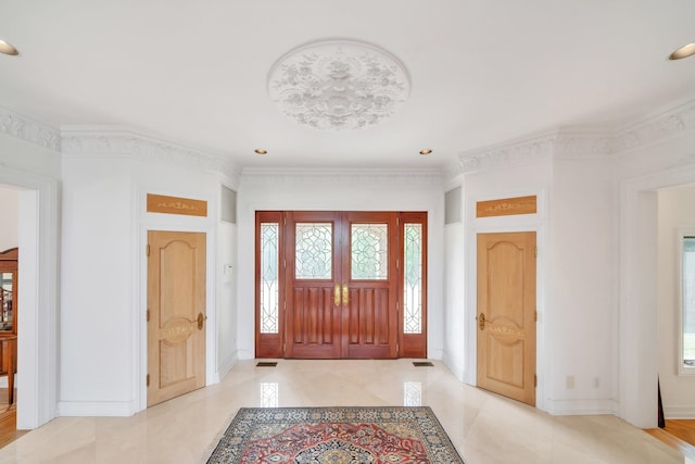 entrance foyer featuring ornamental molding