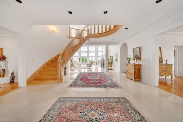 foyer featuring ornamental molding