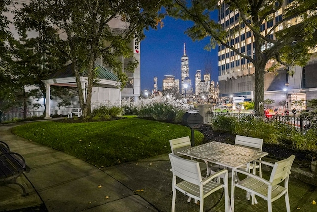 patio at twilight with a yard