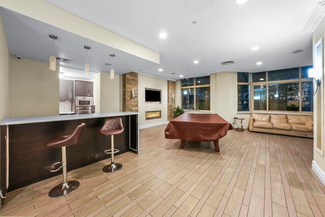 kitchen featuring decorative backsplash, stainless steel appliances, gray cabinetry, and sink