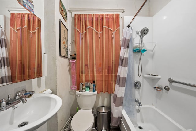 full bathroom with sink, shower / tub combo with curtain, and toilet