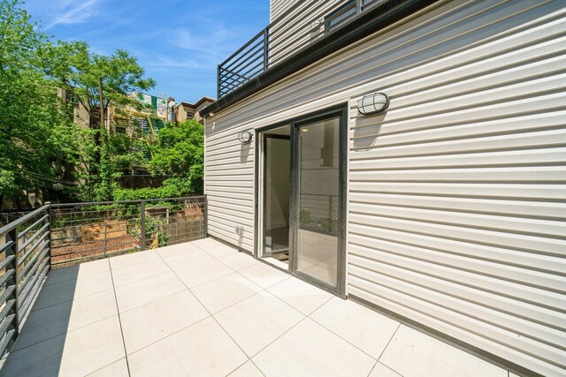 view of patio / terrace with a balcony