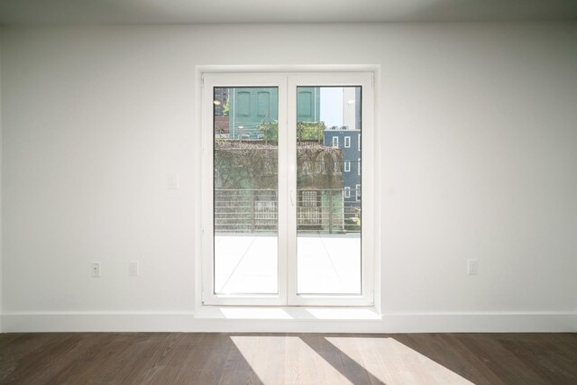 doorway with dark hardwood / wood-style flooring