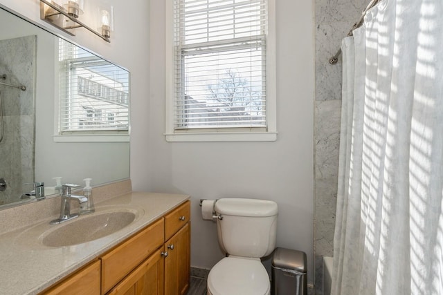 bathroom featuring shower / tub combo with curtain, vanity, and toilet