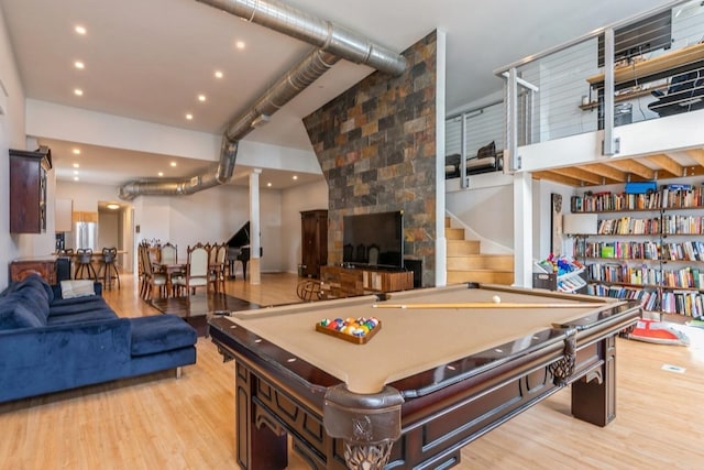 recreation room with billiards and light wood-style flooring