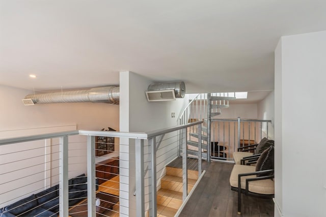 staircase with wood finished floors