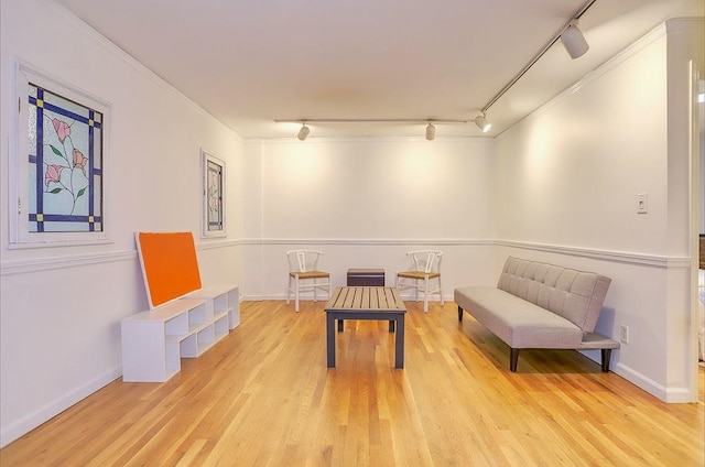 940 Bloomfield St # 1, Hoboken, NJ 07030 - sitting room featuring rail lighting, wood finished floors, and crown molding