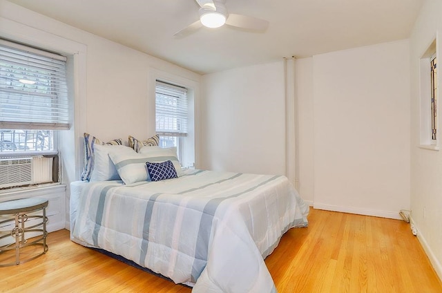 940 Bloomfield St # 1, Hoboken, NJ 07030 - bedroom with light wood-type flooring, cooling unit, and ceiling fan
