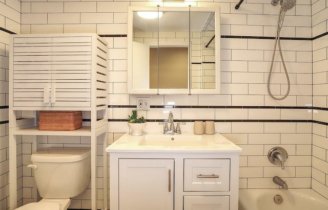 940 Bloomfield St # 1, Hoboken, NJ 07030 - bathroom with vanity, bathtub / shower combination, and tile walls