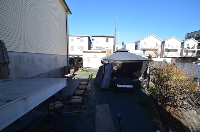 exterior space with a residential view and fence