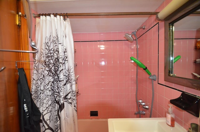 full bathroom with shower / bathtub combination with curtain