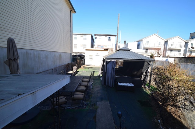 view of yard featuring a residential view and fence