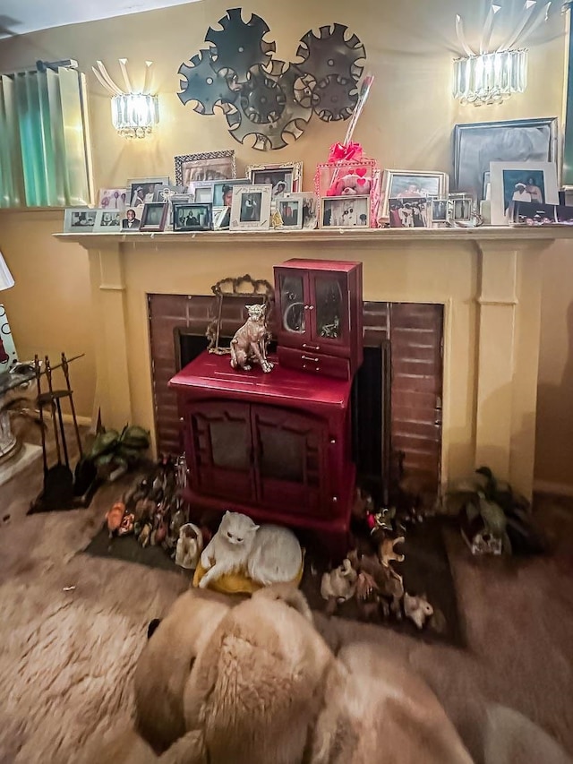 misc room featuring carpet flooring and a fireplace