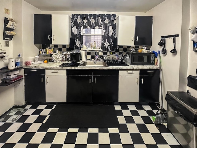 kitchen featuring white cabinets