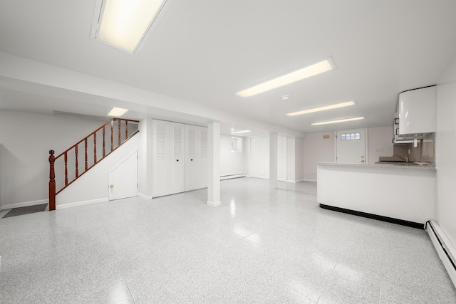 1007 88th St, North Bergen, NJ 07047 - unfurnished living room with baseboard heating and stairs