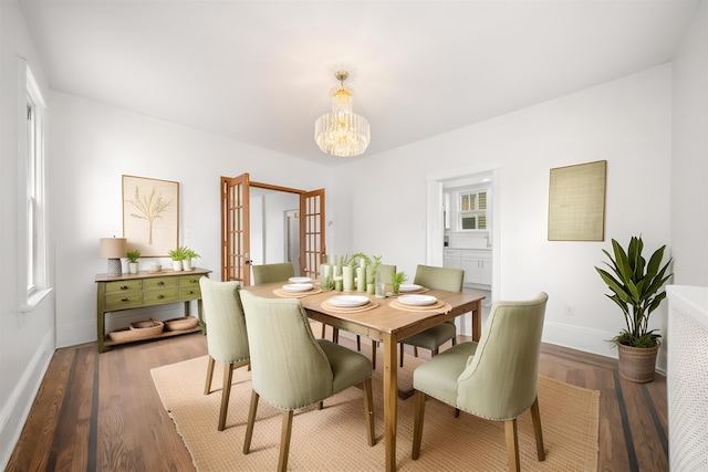 1007 88th St, North Bergen, NJ 07047 - dining area featuring a chandelier and wood finished floors