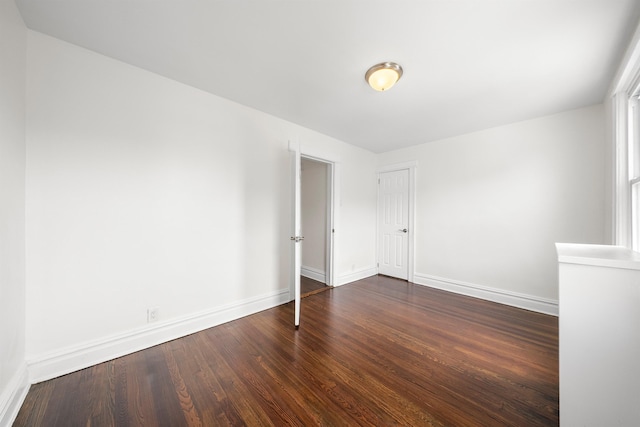 1007 88th St, North Bergen, NJ 07047 - spare room featuring baseboards and dark wood finished floors