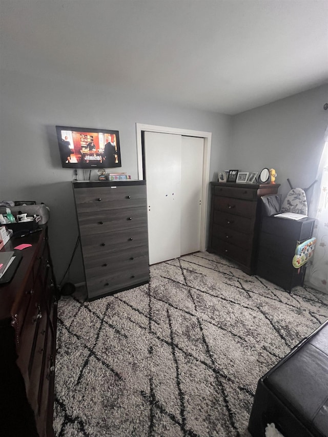 carpeted bedroom featuring a closet