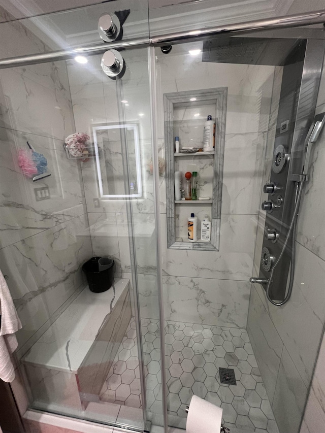 bathroom with a shower with shower door