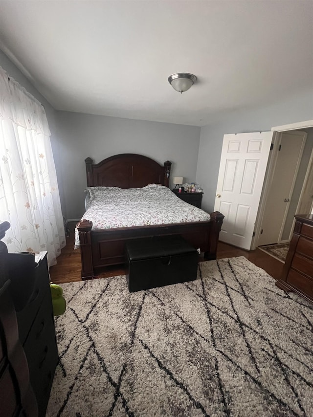 bedroom with hardwood / wood-style flooring