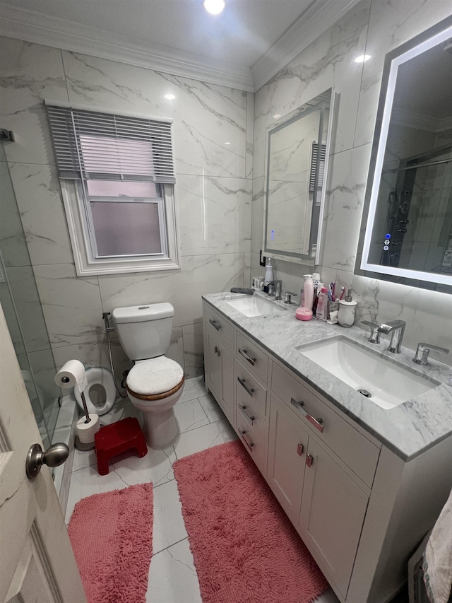 bathroom with tile walls, vanity, ornamental molding, a shower with shower door, and toilet