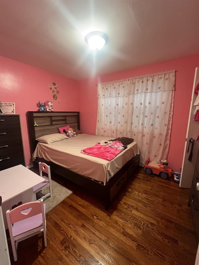 bedroom featuring dark hardwood / wood-style floors