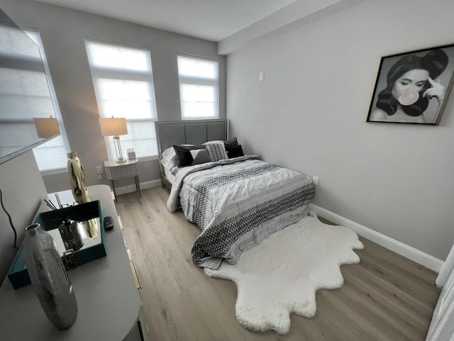 bedroom with light hardwood / wood-style flooring