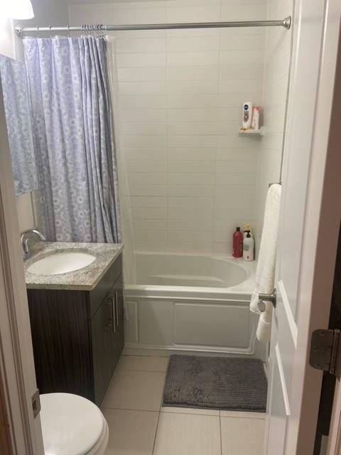 341 Monmouth St Unit 308D, Jersey City, NJ 07302 - bathroom with tile patterned flooring, shower / bath combination with curtain, and vanity