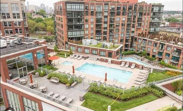 pool featuring a city view and a patio