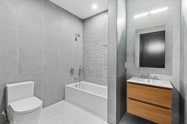 full bathroom featuring shower / bathing tub combination, vanity, tile walls, and toilet