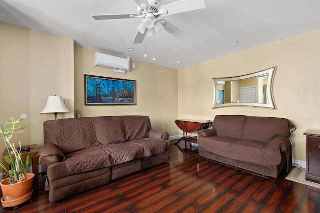 living area featuring a wall unit AC, wood finished floors, baseboards, ceiling fan, and recessed lighting
