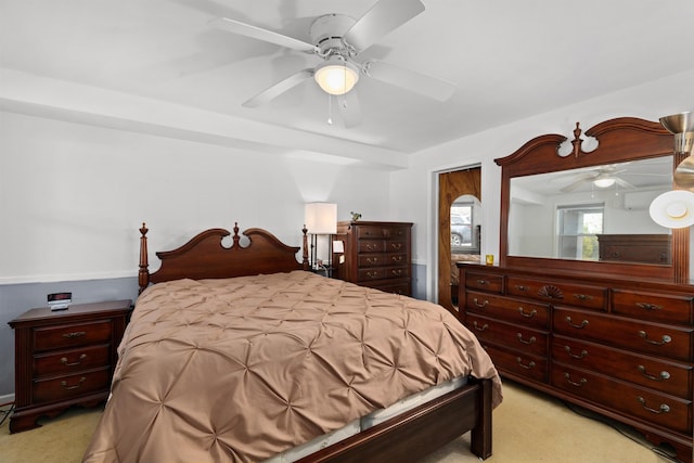 bedroom featuring light colored carpet and ceiling fan