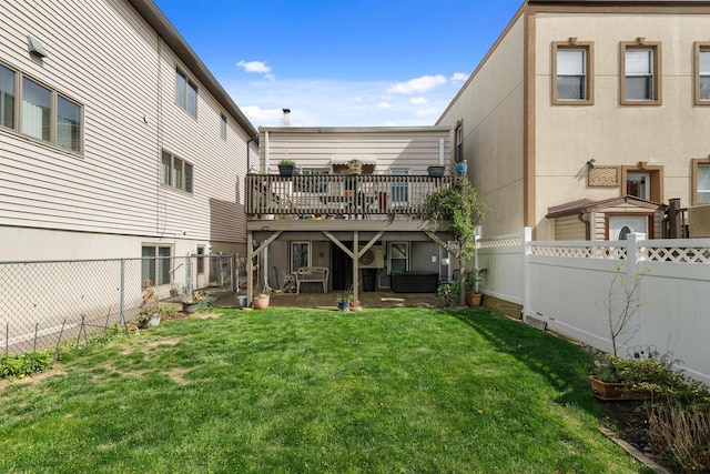 back of house with a deck