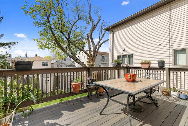 deck with outdoor dining area