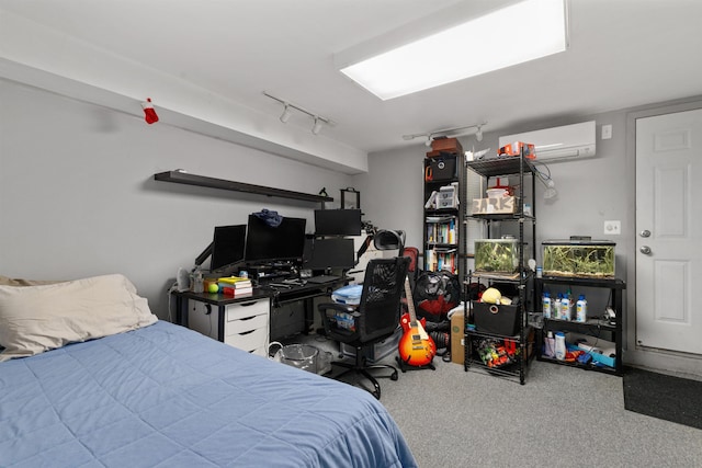 bedroom featuring an AC wall unit, carpet flooring, and rail lighting