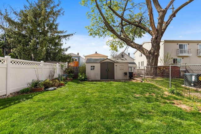 view of yard featuring a shed and an outbuilding
