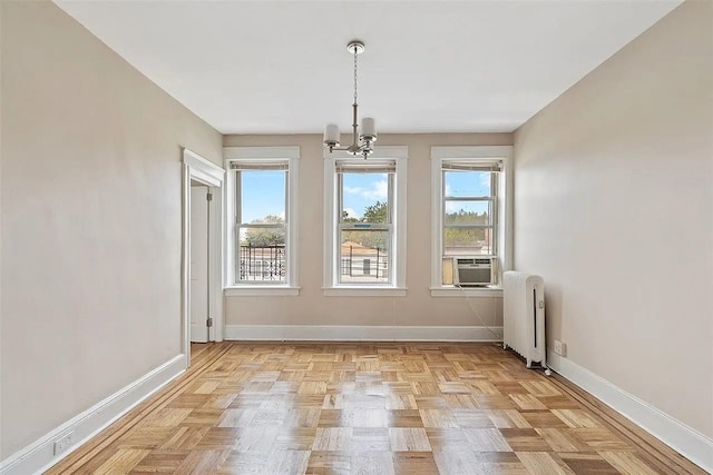 16 Belvidere Ave Unit 3F, Jersey City, NJ 07304 - unfurnished dining area featuring radiator, baseboards, a chandelier, and cooling unit