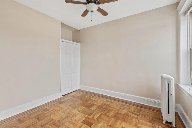 16 Belvidere Ave Unit 3F, Jersey City, NJ 07304 - spare room featuring ceiling fan, baseboards, and radiator heating unit