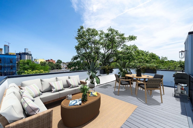70 Gardner Ave Unit 2, Jersey City, NJ 07304 - deck with an outdoor hangout area, outdoor dining space, area for grilling, and a view of city