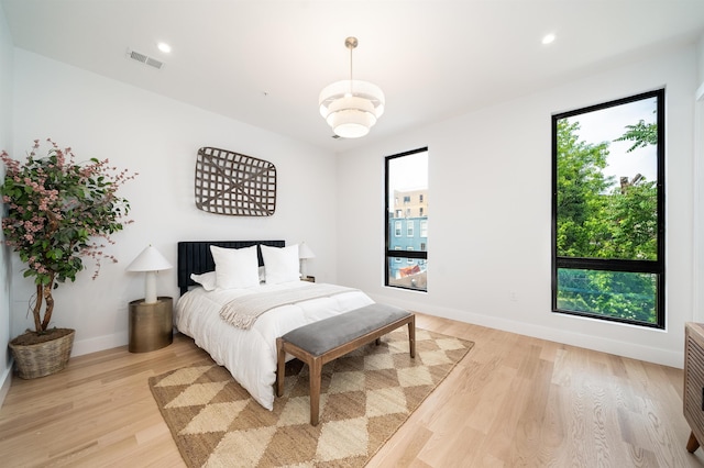 70 Gardner Ave Unit 2, Jersey City, NJ 07304 - bedroom with multiple windows, light wood-style floors, baseboards, and recessed lighting